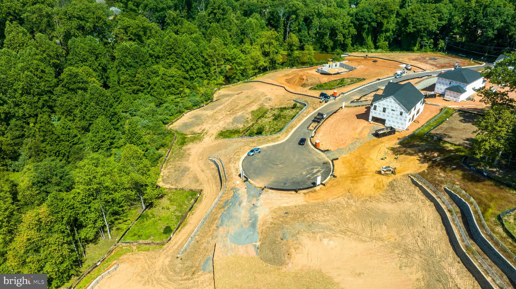 3557 Orchid Pond Way Oakton, VA 22124 - Photo 37 of 38 a aerial view of a house with swimming pool and large trees