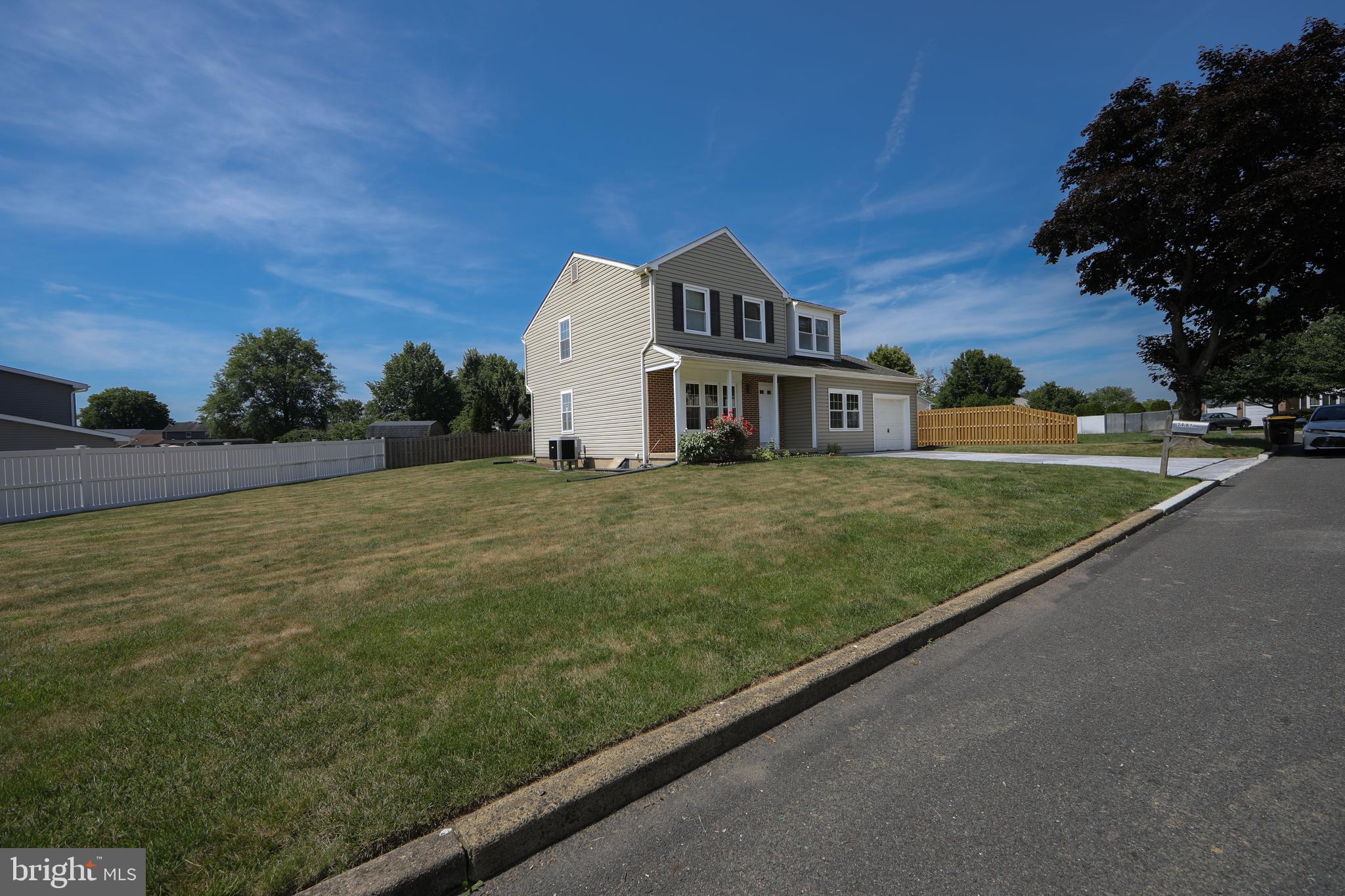 3007 Rampart Road Bensalem, PA 19020 - Photo 5 of 48 a view of a street in front of a house with a yard
