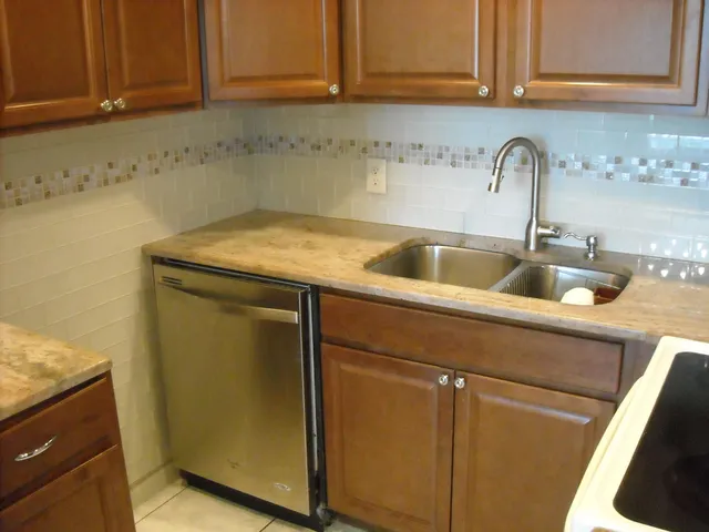 a kitchen with a sink and cabinets