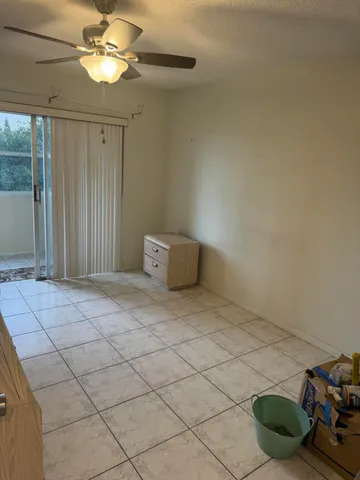 a bedroom with a bed and a table in it