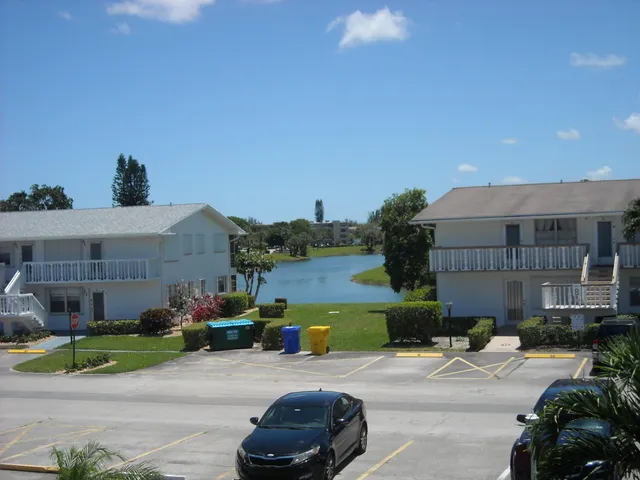 a view of a backyard with sitting area and furniture