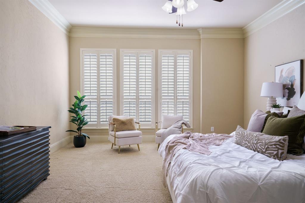 9106 Cochran Bluff Lane Dallas, TX 75220 - Photo 36 of 40 Carpeted bedroom featuring ornamental molding and a ceiling fan