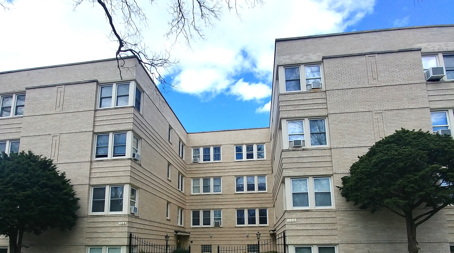 100 Pine Avenue, Unit 2 Riverside, IL 60546 - Photo 1 of 12 a view of a building with a tree