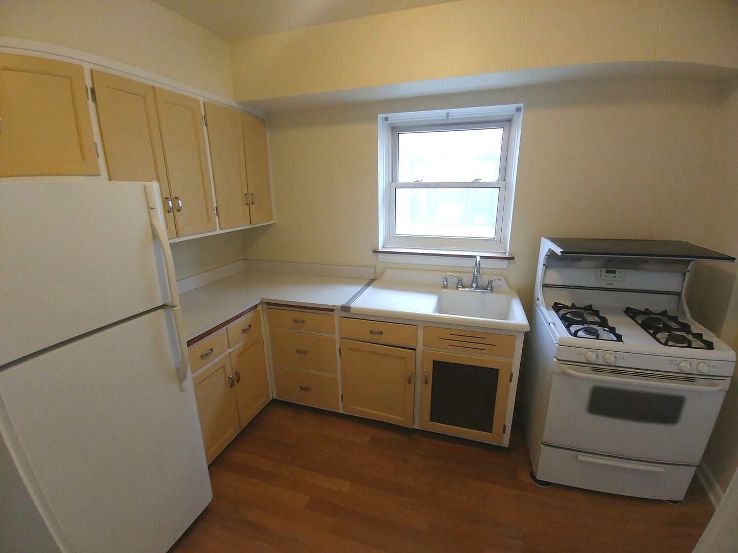 100 Pine Avenue, Unit 2 Riverside, IL 60546 - Photo 4 of 12 a kitchen with a stove white cabinets and a sink