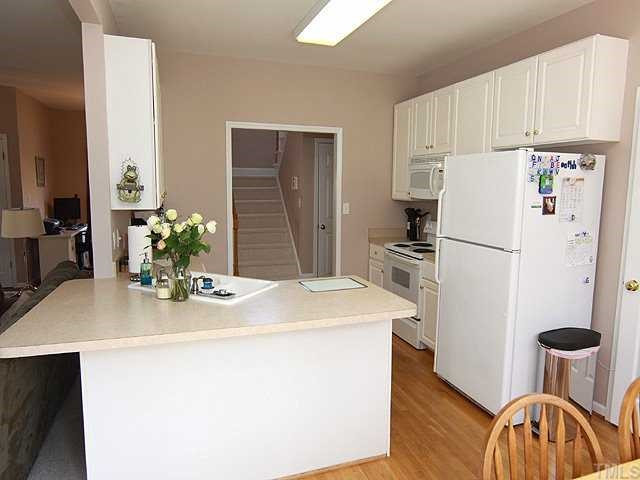 1608 Cheshire Bridge Road Durham, NC 27712 - Photo 4 of 12 Kitchen w/Eat In Area, Opens to Family Room w/ access to Deck