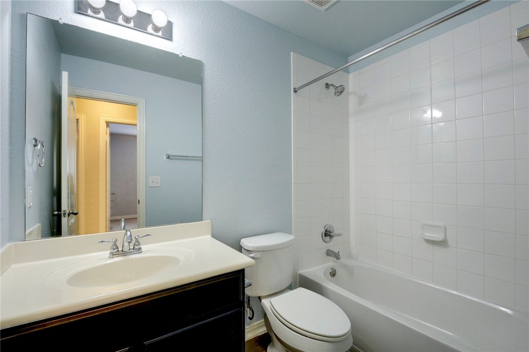 3621 Rams Horn Way Round Rock, TX 78665 - Photo 20 of 24 a bathroom with a sink a toilet and shower