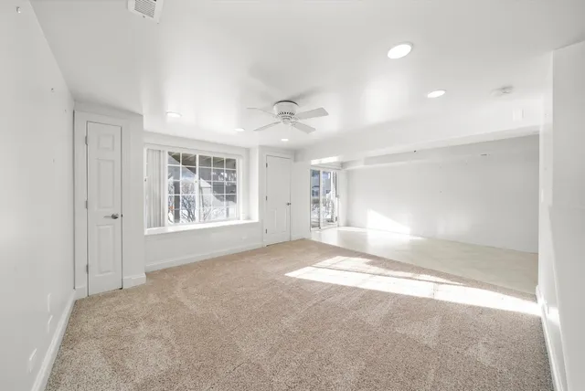 a view of livingroom with a ceiling fan and window