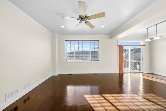 a view of livingroom with hardwood floor and a ceiling fan
