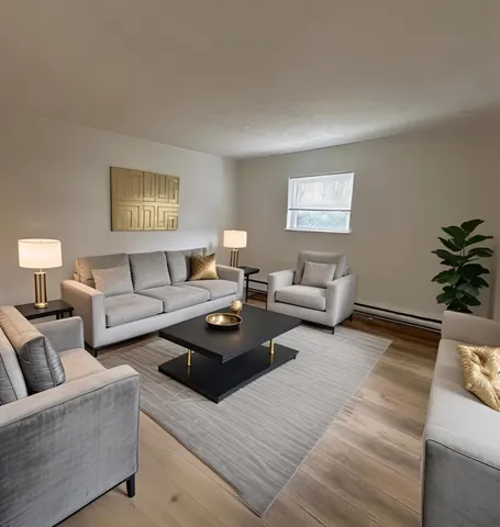 a living room with furniture and a window