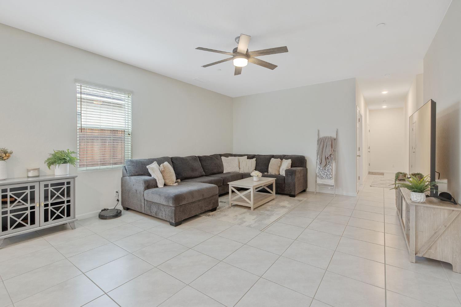 535 Sandtrap Lane Lemoore, CA 93245 - Photo 13 of 36 a living room with furniture and a flat screen tv