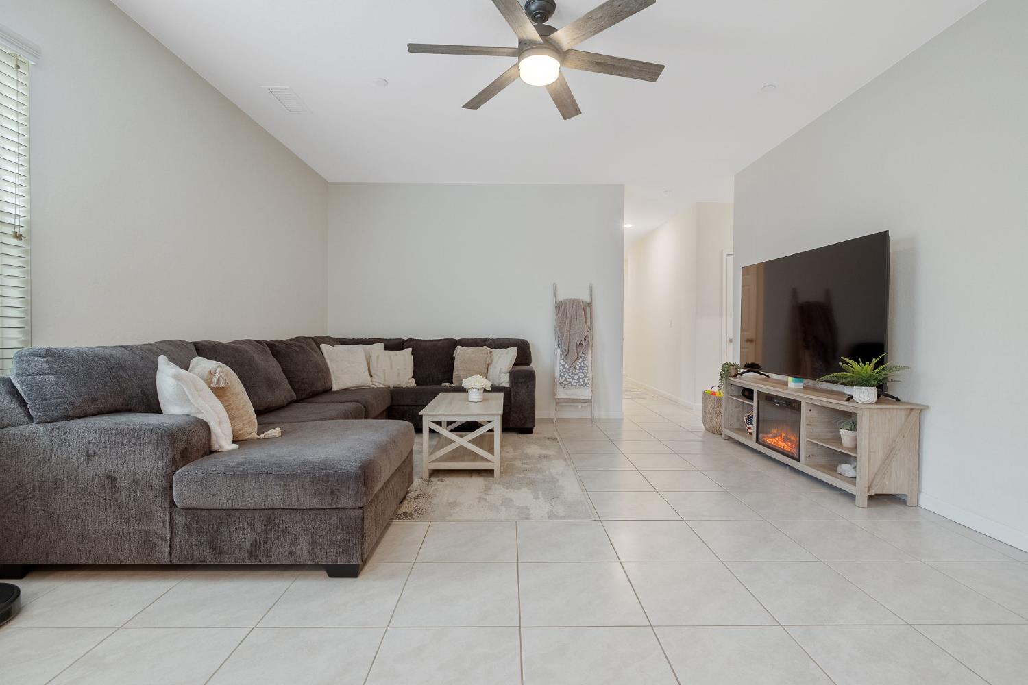 535 Sandtrap Lane Lemoore, CA 93245 - Photo 14 of 36 a living room with furniture and a flat screen tv