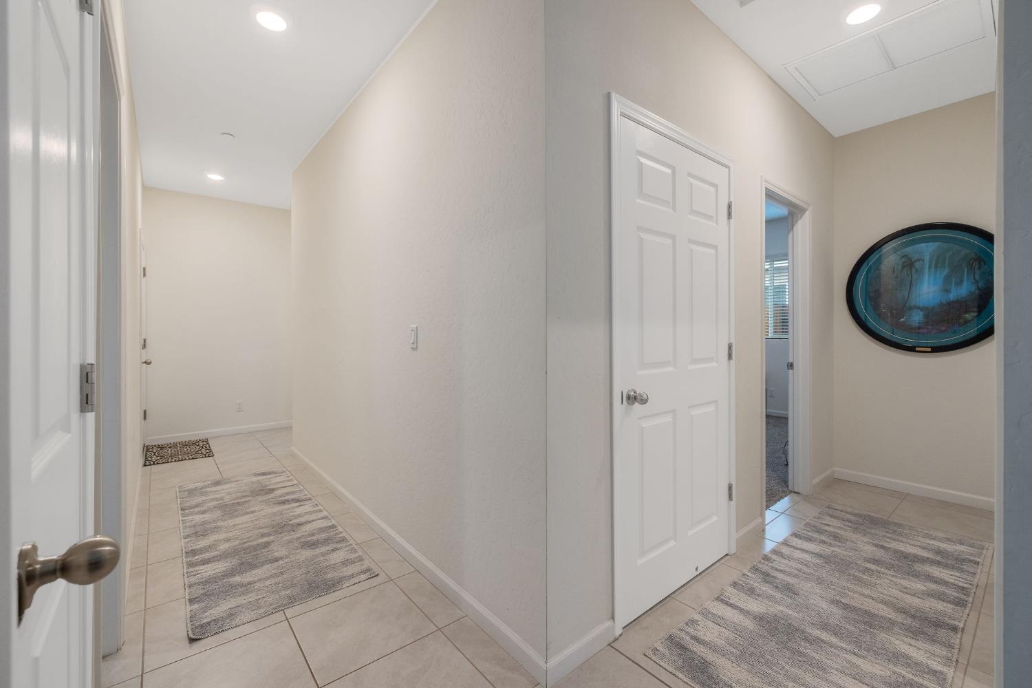 535 Sandtrap Lane Lemoore, CA 93245 - Photo 17 of 36 a view of a hallway and wooden floor