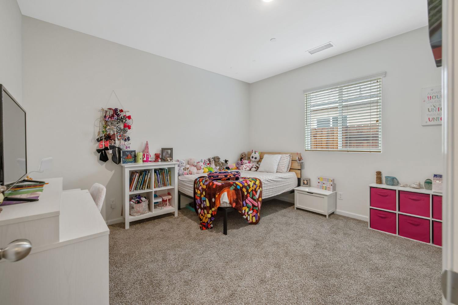 535 Sandtrap Lane Lemoore, CA 93245 - Photo 20 of 36 a bed room with a bed and a couch