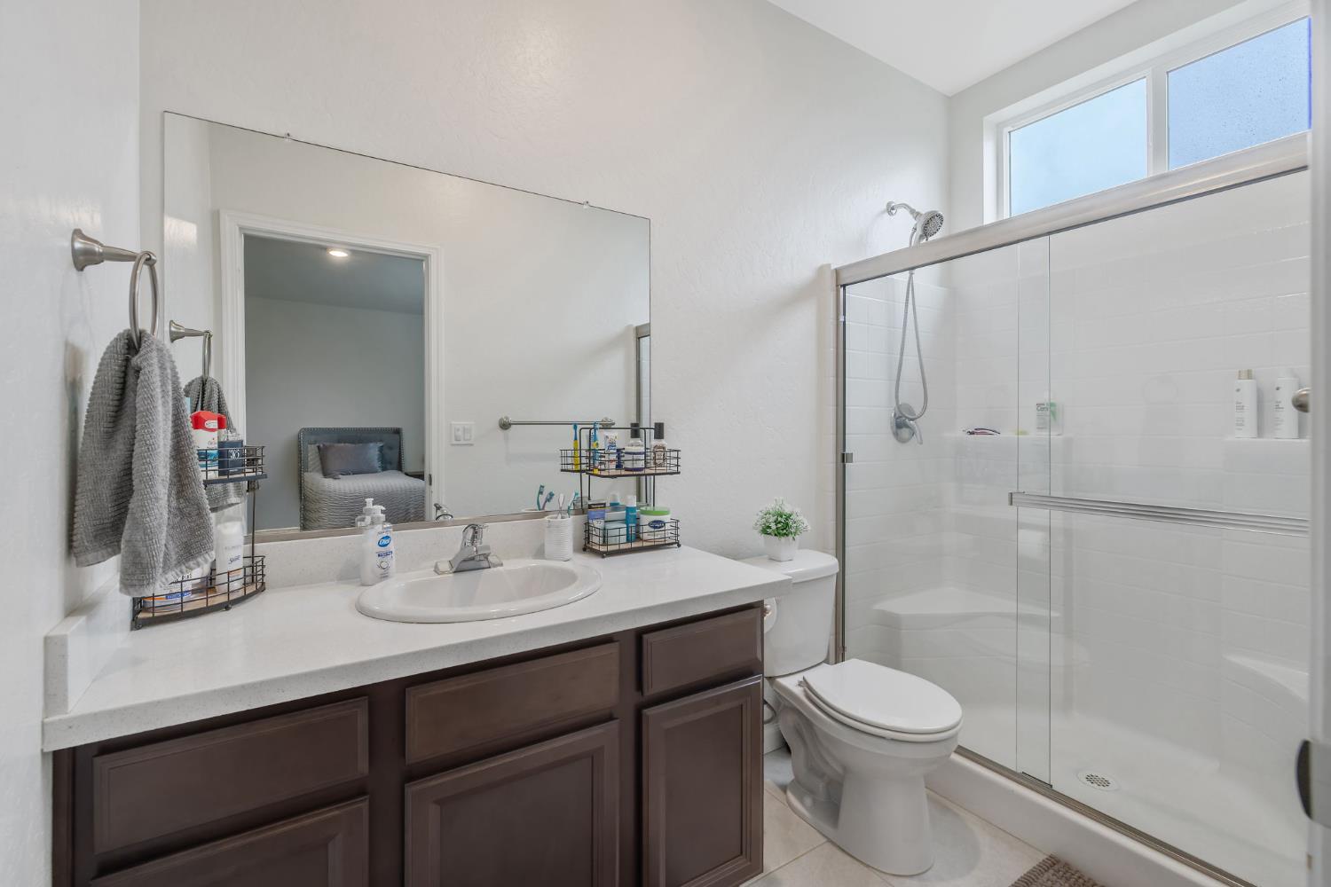 535 Sandtrap Lane Lemoore, CA 93245 - Photo 26 of 36 a bathroom with a sink a toilet and shower