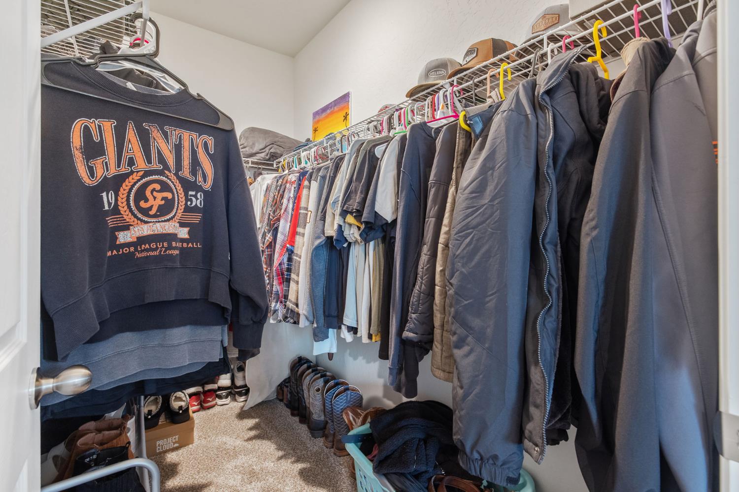 535 Sandtrap Lane Lemoore, CA 93245 - Photo 27 of 36 a view of walk in closet with clothes