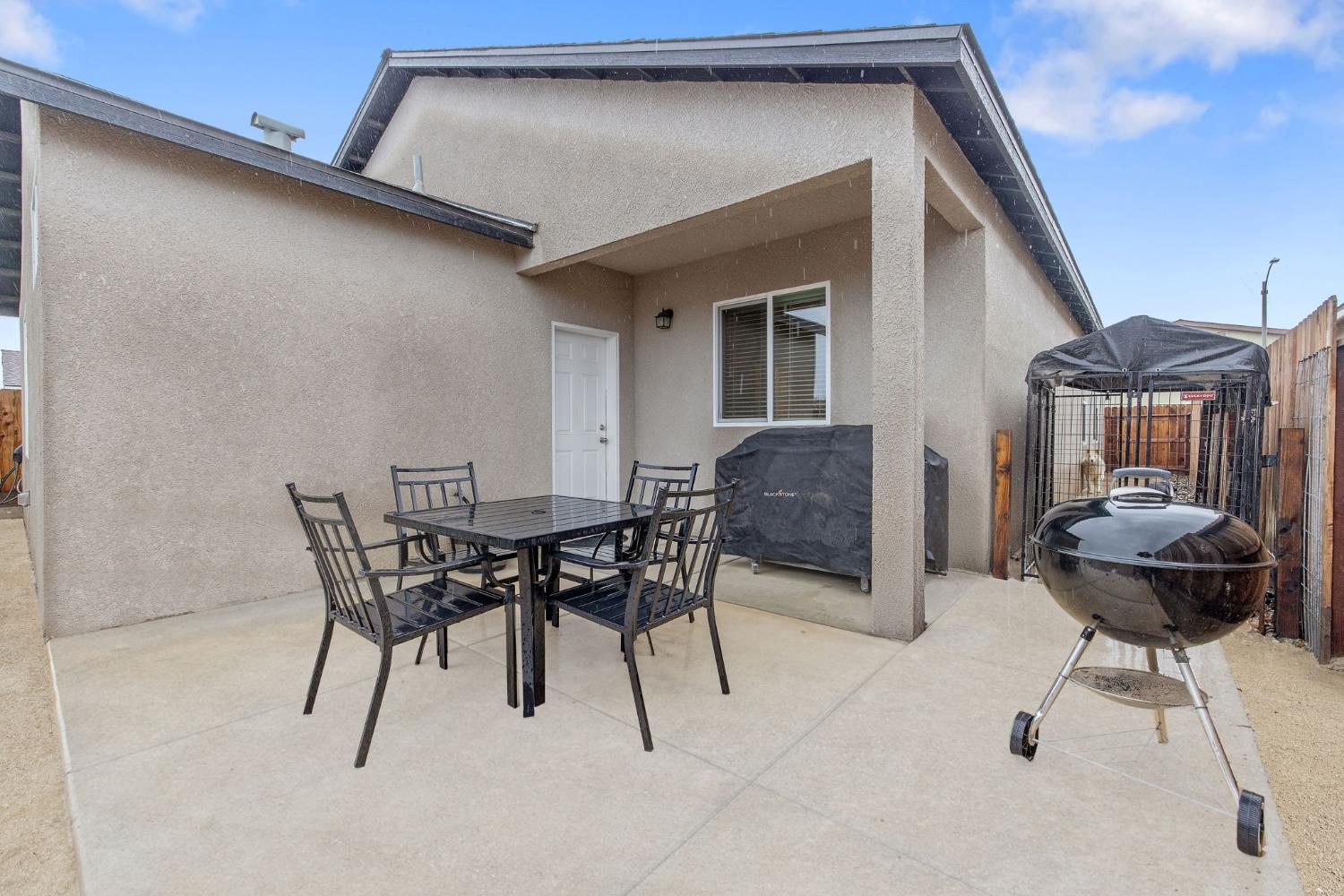 535 Sandtrap Lane Lemoore, CA 93245 - Photo 30 of 36 a view of a patio with table and chairs