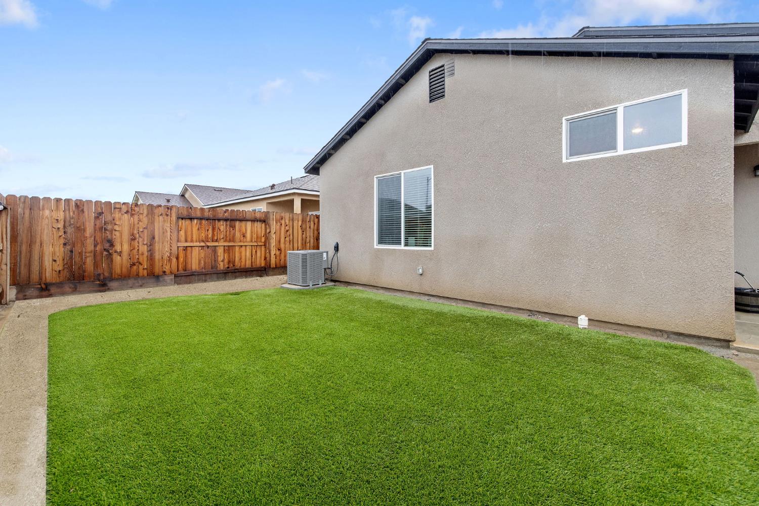 535 Sandtrap Lane Lemoore, CA 93245 - Photo 34 of 36 a backyard of a house with lots of green space