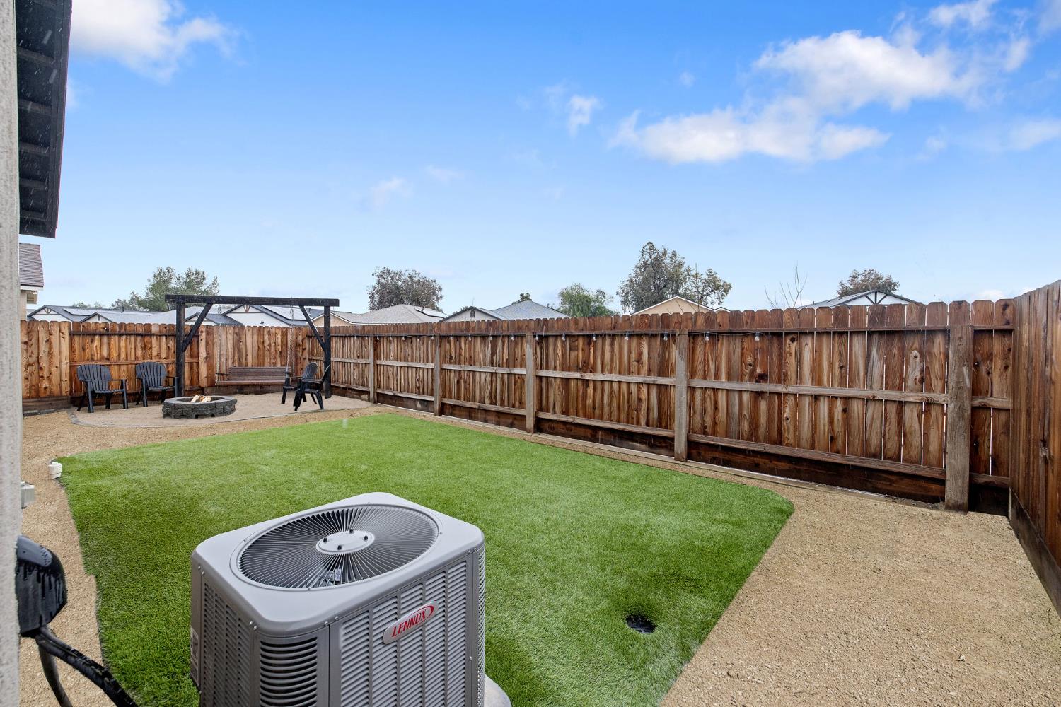 535 Sandtrap Lane Lemoore, CA 93245 - Photo 36 of 36 a view of a backyard with a garden