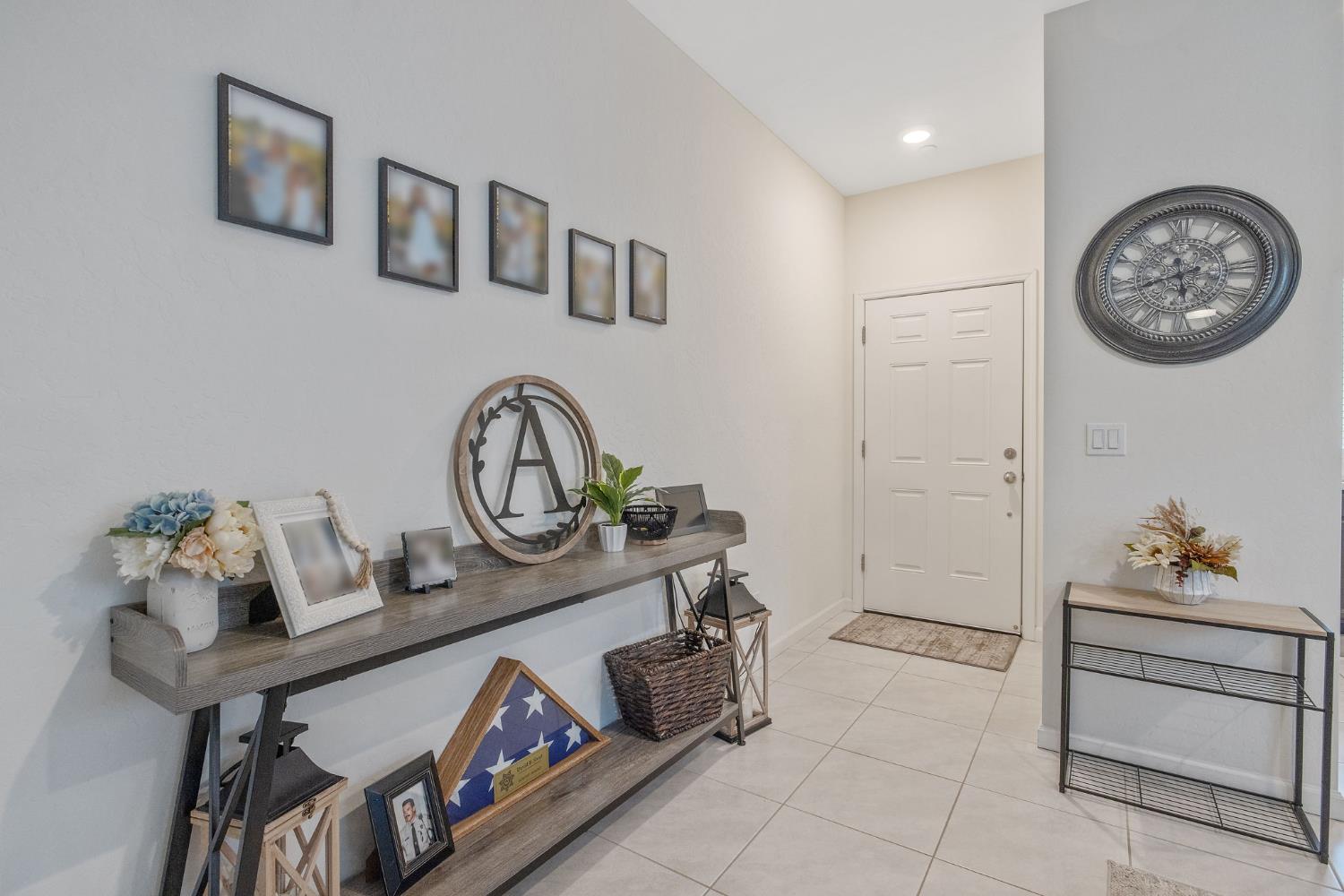 535 Sandtrap Lane Lemoore, CA 93245 - Photo 5 of 36 a view of a hallway to dining room and wooden floors