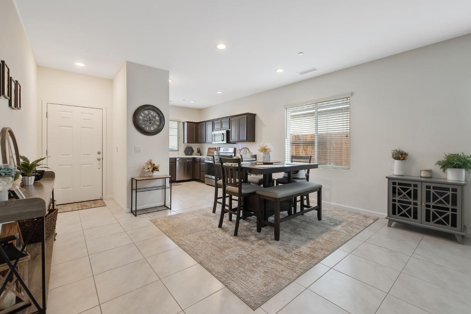 535 Sandtrap Lane Lemoore, CA 93245 - Photo 6 of 36 a view of a dining area with furniture