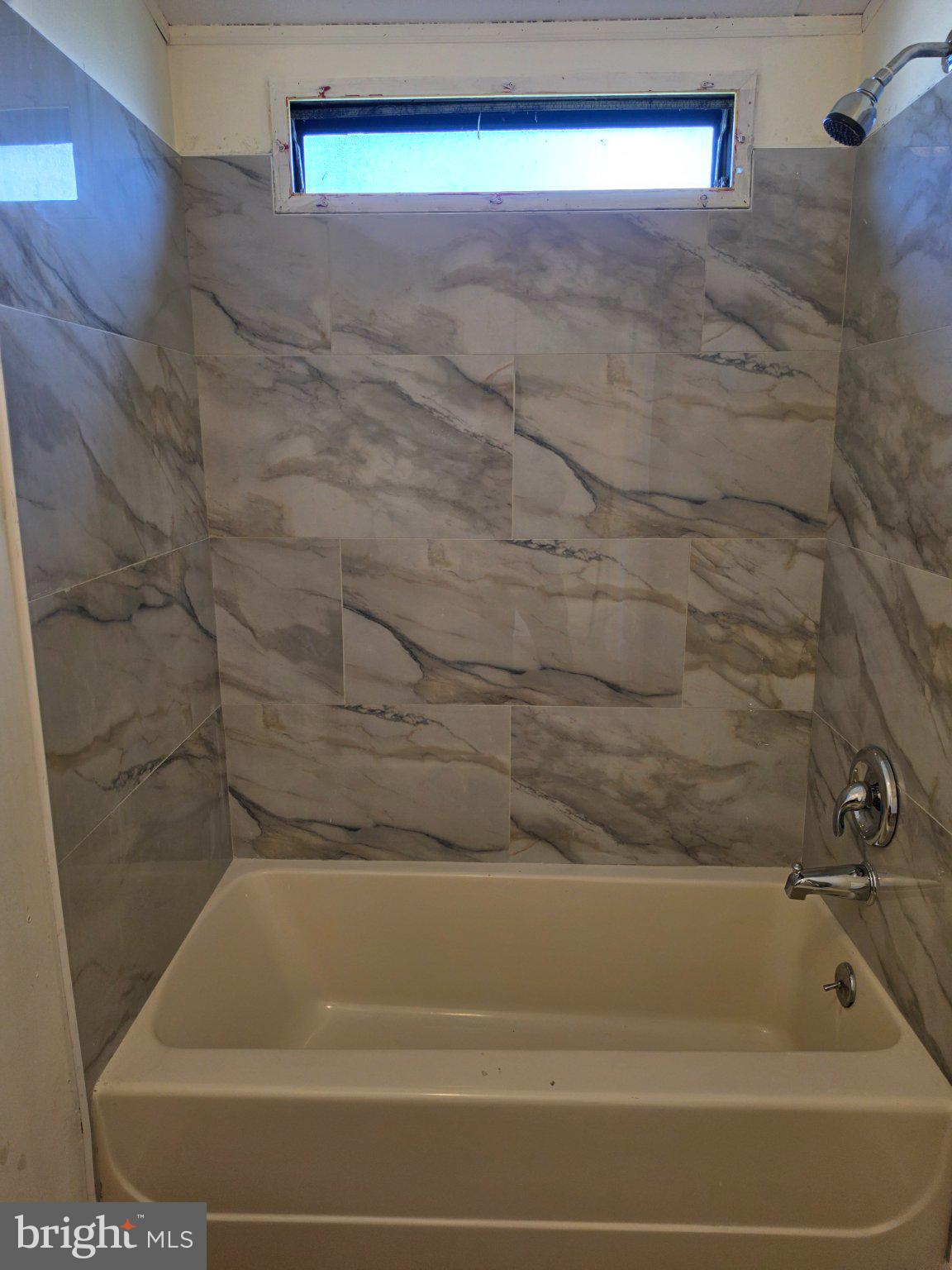 864 Aspen Avenue Spring City, PA 19475 - Photo 17 of 18 Modern tub with elegant marble walls.