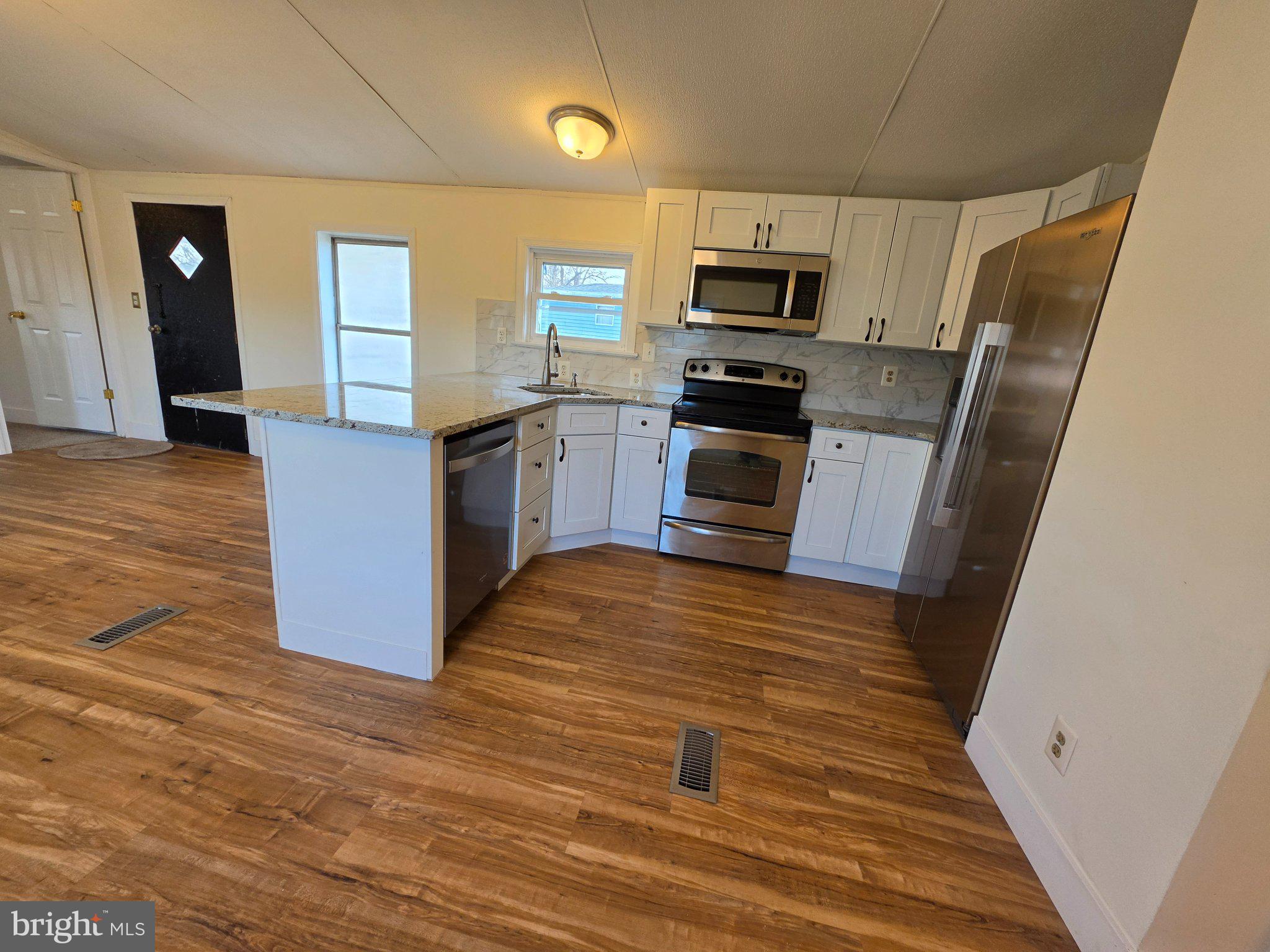 864 Aspen Avenue Spring City, PA 19475 - Photo 5 of 18 Modern kitchen with sleek finishes.
