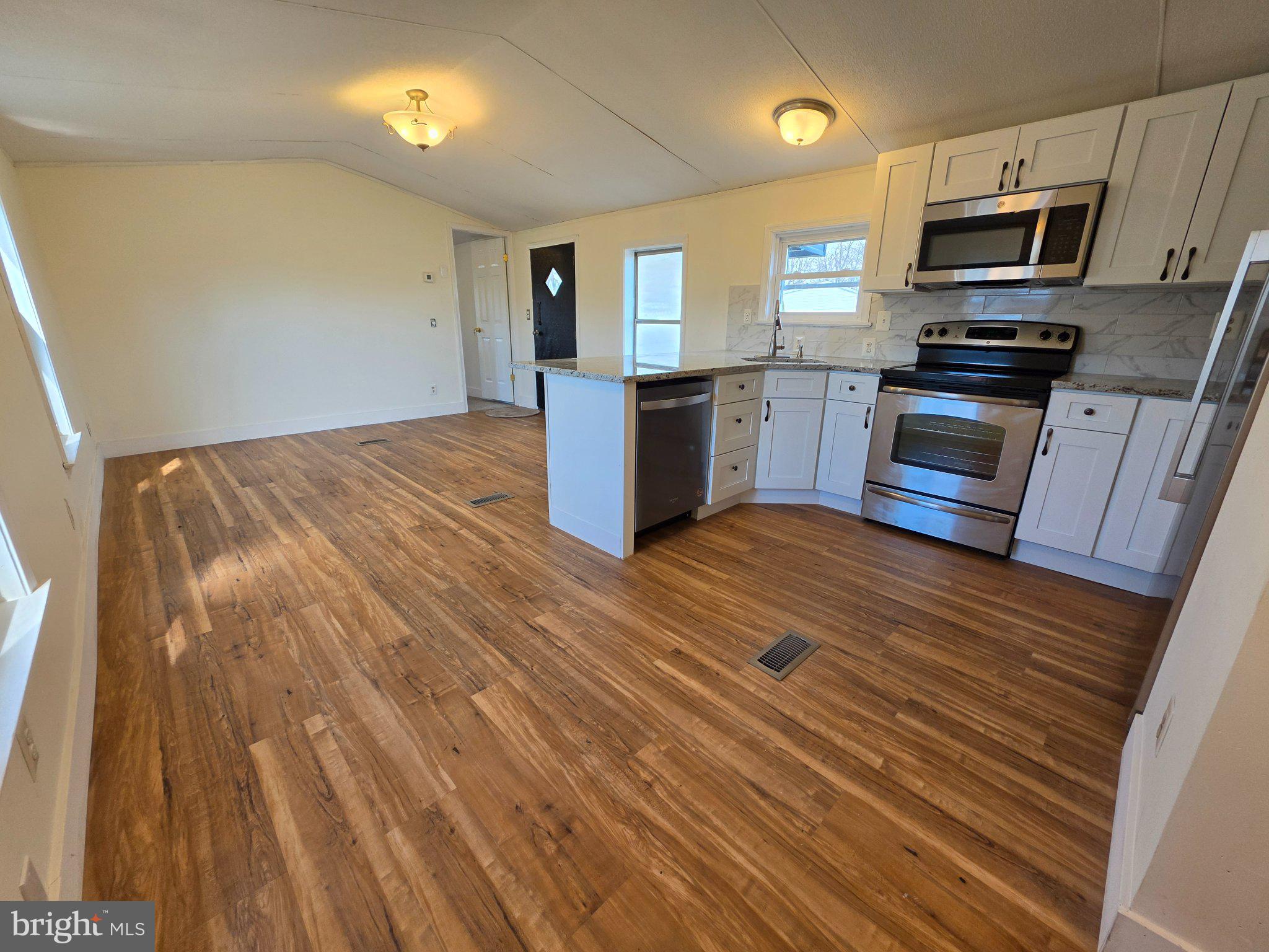 864 Aspen Avenue Spring City, PA 19475 - Photo 6 of 18 Bright, modern kitchen with wood floors.