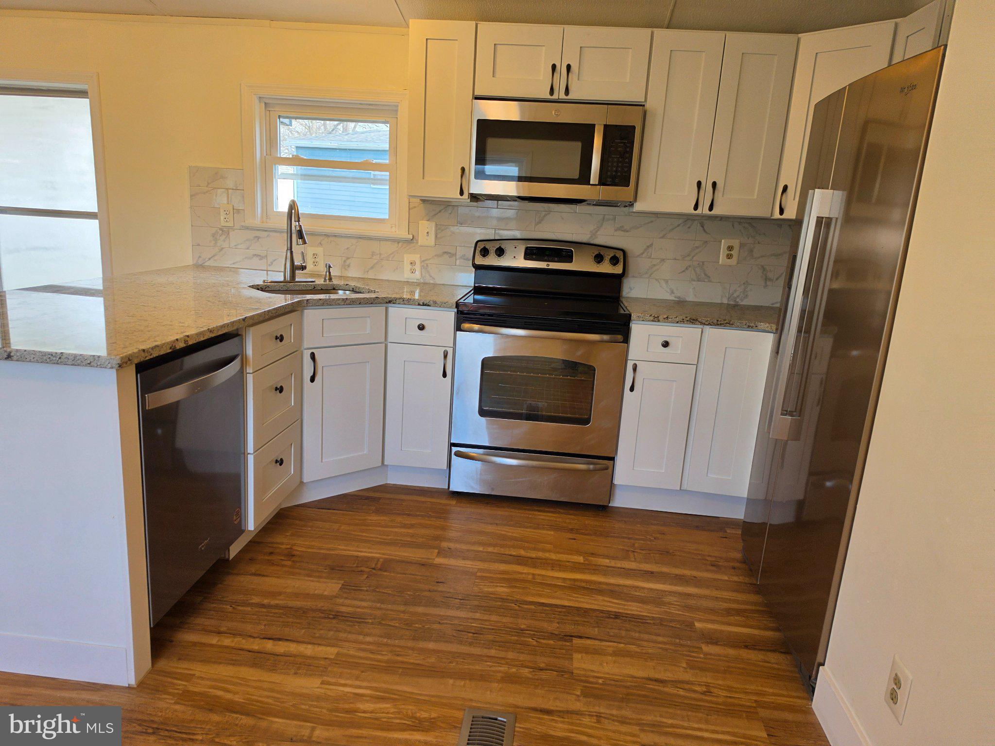 864 Aspen Avenue Spring City, PA 19475 - Photo 7 of 18 Modern kitchen with sleek finishes.