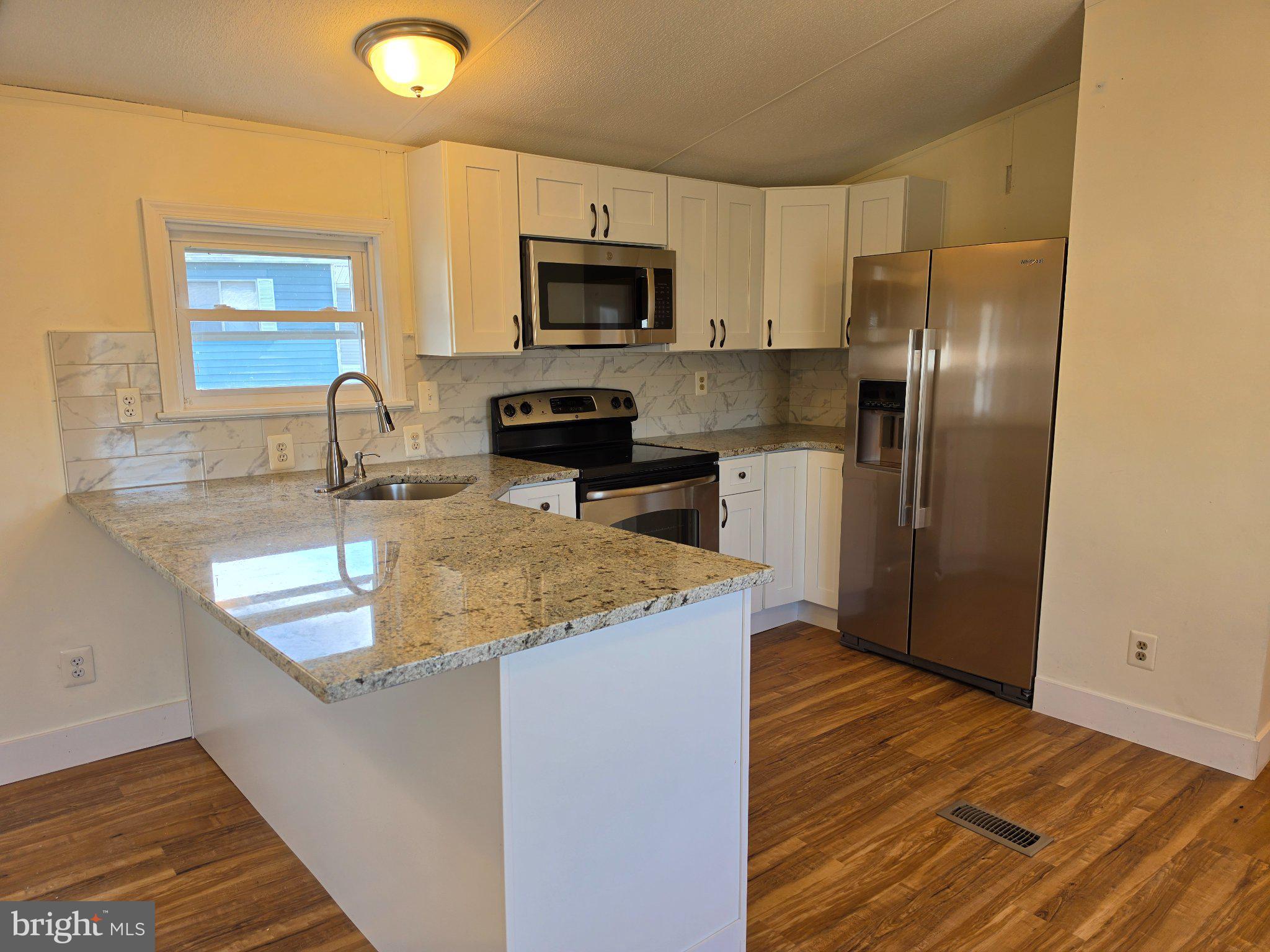 864 Aspen Avenue Spring City, PA 19475 - Photo 8 of 18 Modern kitchen with sleek finishes.