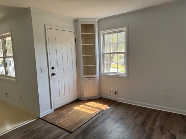 539 Faulkner Street Cleveland, GA 30528 - Photo 16 of 25 an empty room with wooden floor and windows