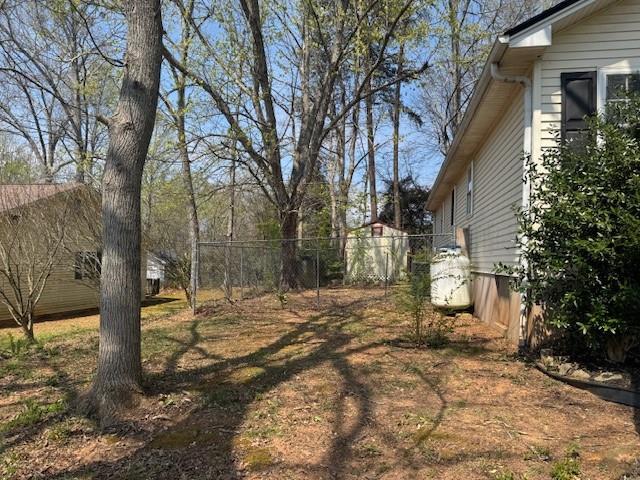 539 Faulkner Street Cleveland, GA 30528 - Photo 6 of 25 a view of a yard with plants and trees