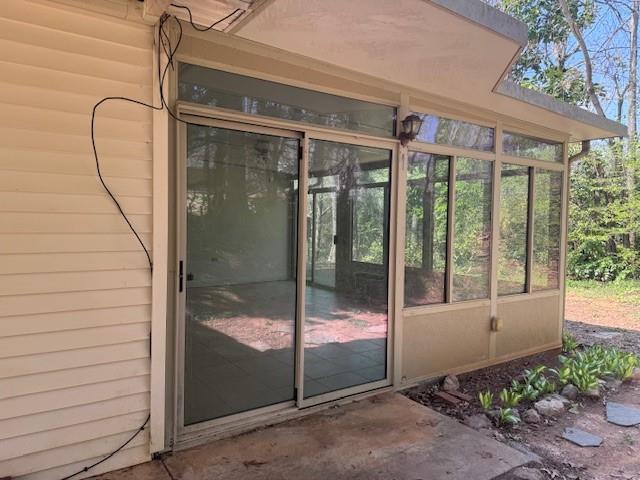 539 Faulkner Street Cleveland, GA 30528 - Photo 10 of 25 a glass door with a glass door and glass door