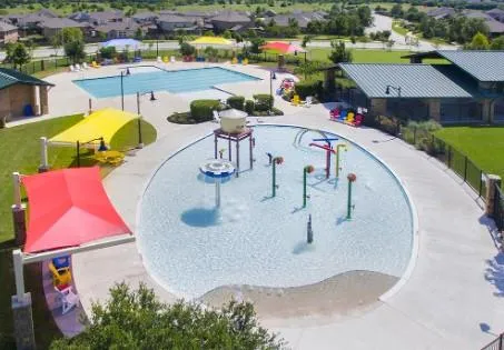 an aerial view of a house with swimming pool