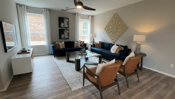 a living room with furniture and a window