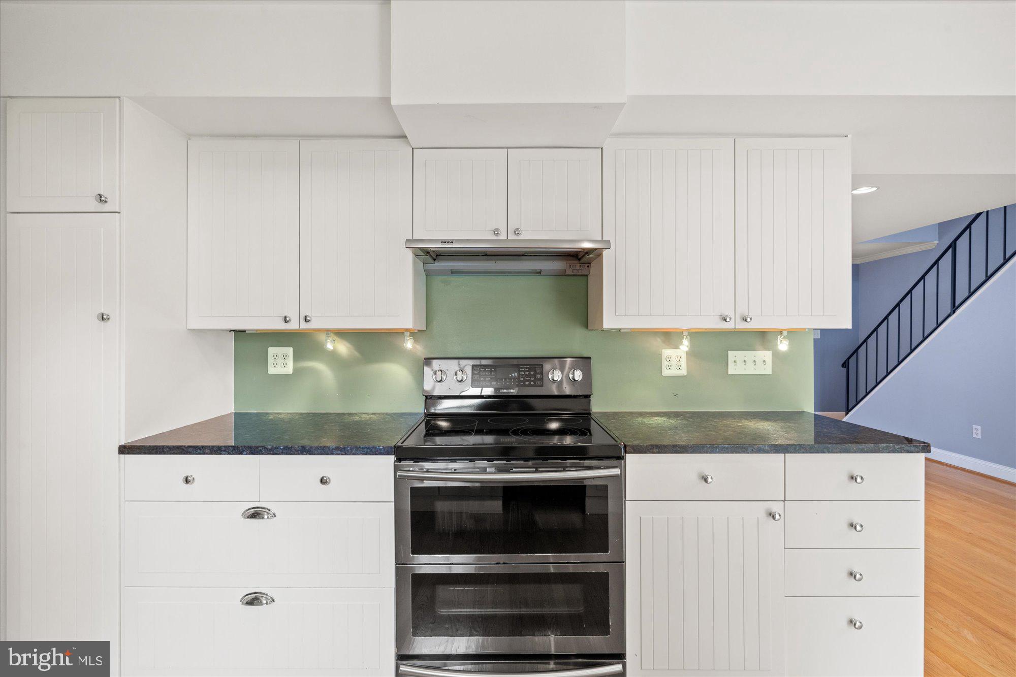 5406 Dunsmore Road Alexandria, VA 22315 - Photo 7 of 31 Modern kitchen with sleek finishes.