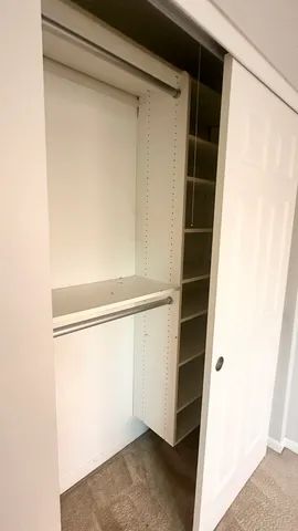 a view of an empty walk in closet