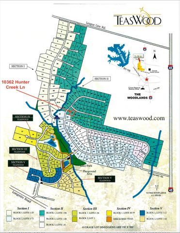 a front view of a house with a garden and trees