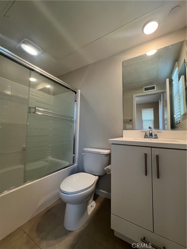 177 Magnet Irvine, CA 92618 - Photo 13 of 37 a bathroom with a toilet a sink and shower