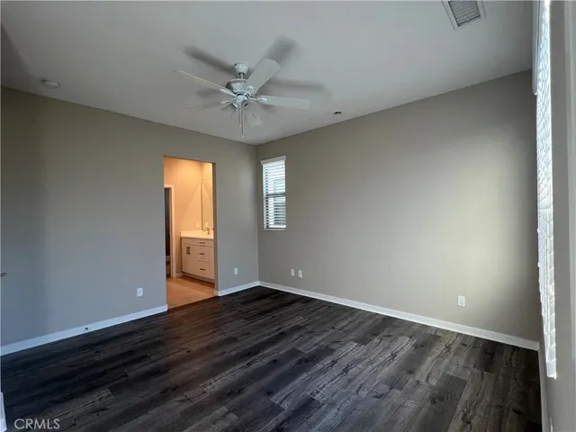 a white toilet sitting next to a window