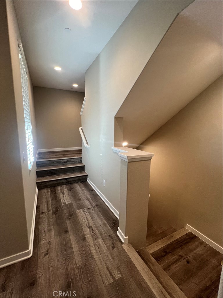 177 Magnet Irvine, CA 92618 - Photo 24 of 37 a view of a room with wooden floor and stairs