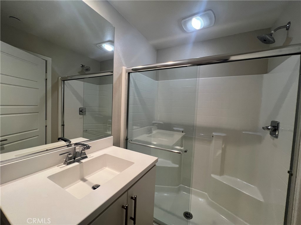 177 Magnet Irvine, CA 92618 - Photo 27 of 37 a bathroom with a sink shower and a mirror