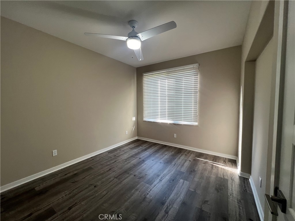 177 Magnet Irvine, CA 92618 - Photo 28 of 37 a view of an empty room with wooden floor and a window
