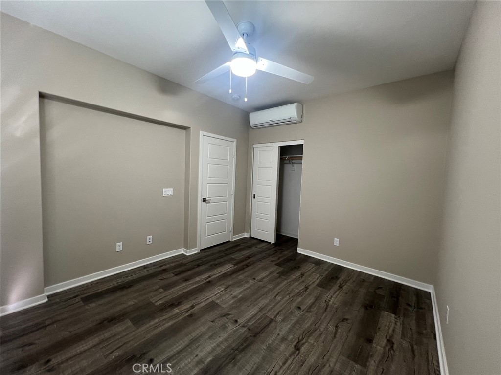 177 Magnet Irvine, CA 92618 - Photo 29 of 37 an empty room with wooden floor and a ceiling fan