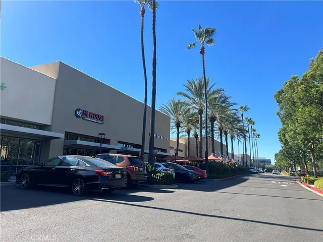 a black car parked in front of building