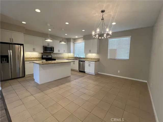 a kitchen with a sink and refrigerator