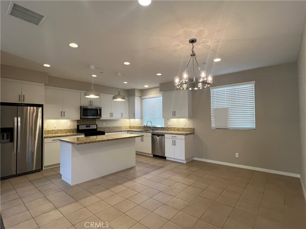177 Magnet Irvine, CA 92618 - Photo 6 of 37 a kitchen with a sink and refrigerator