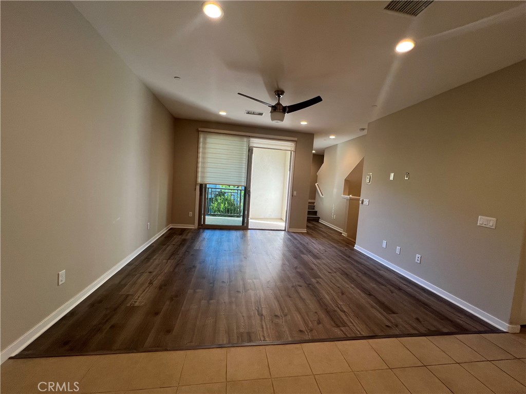 177 Magnet Irvine, CA 92618 - Photo 9 of 37 wooden floor in an empty room with a window