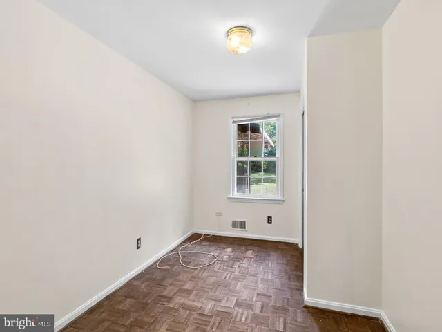 a large kitchen with stainless steel appliances granite countertop a refrigerator and a stove top oven