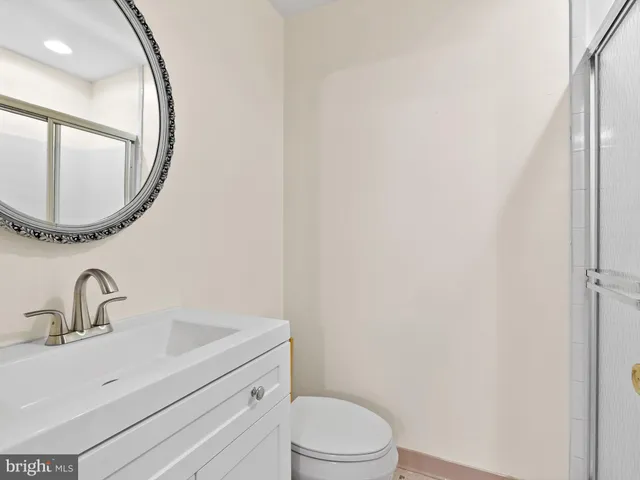 a room with white cabinets and white appliances