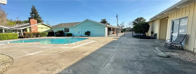 a view of a room with wooden cabinets